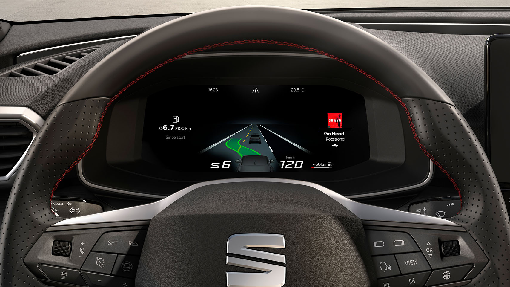 close up of seat leon steering wheel with buttons and digital speedometer display behind, music streaming and air vents